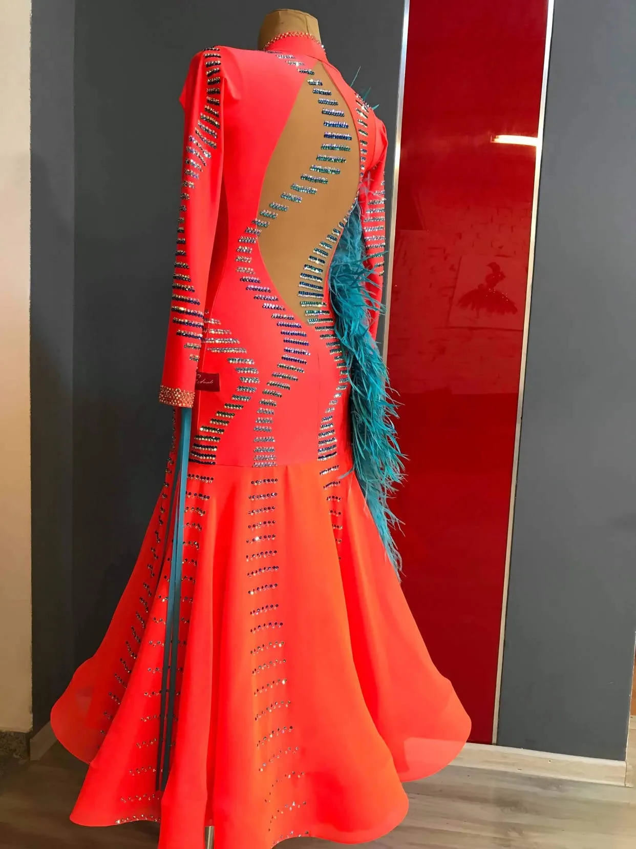 Vibrant Ballroom Dress in Orange with Blue Feathers