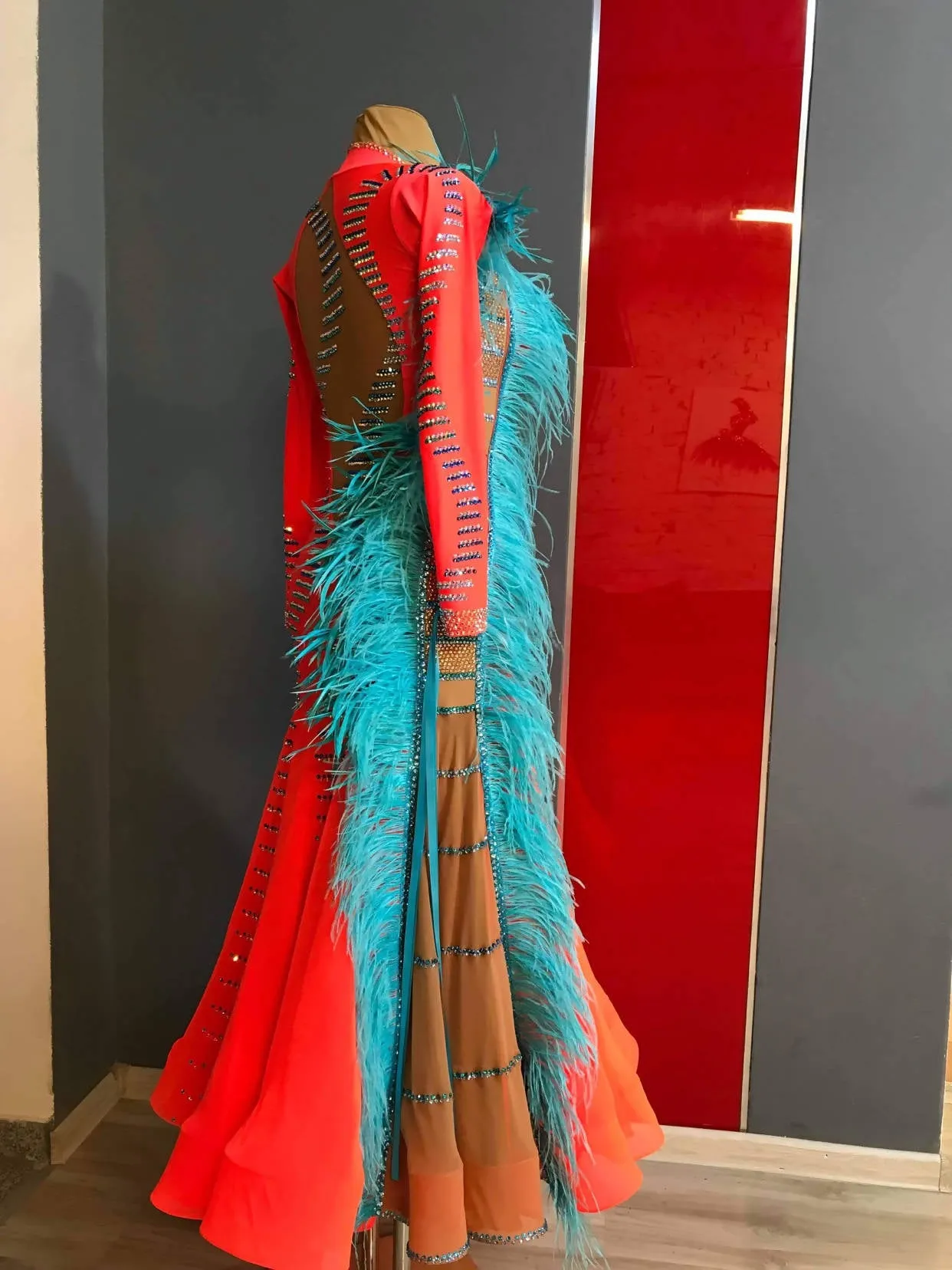 Vibrant Ballroom Dress in Orange with Blue Feathers