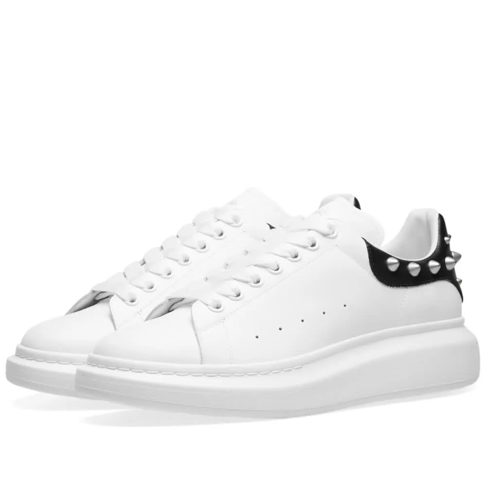 Stylish Alexander McQueen Studded Heel Sneaker in White & Black